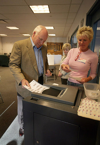 Vice President Dick Cheney casts his ballot in...