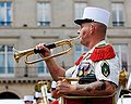 A Caporal-chef, with 3 chevrons of seniority, bugling during the Bastille Day Military Parade.[64]