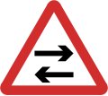 B22: Two-way traffic crosses one way road