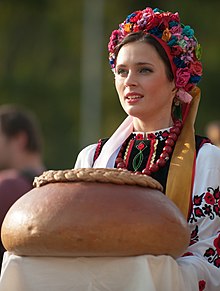 A Ukrainian woman in national dress welcoming with bread and salt Rapid Trident 2014 03.jpg