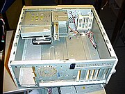 A stripped ATX case lying on its side.