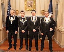 U2 were recipients of Kennedy Center Honors in 2022. U2 at the 2022 Kennedy Center Honors Dinner (52542570840).jpg