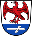 Gemeinde Huglfing Über blauem Schildfuß, darin ein liegendes, nach links gerichtetes silbernes Kreuz, in Silber ein auffliegender roter Falke.