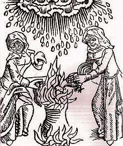 Witches add ingredients to a cauldron.JPG