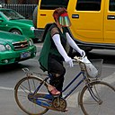 Woman is riding her bike
