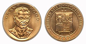 A gold medallion depicting the bust of a man, as well as a painting
