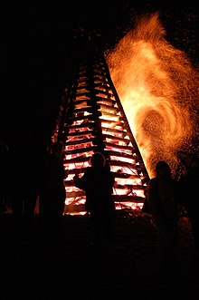 A Christmas Eve celebration bonfire in Louisiana, United States Bonfire on Mississippi River levee St. James Parish Louisiana.jpg