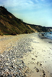 Pebble beach made up of flint nodules eroded from the nearby chalk cliffs, Cape Arkona, Rugen, northeast Germany Flintbeach.jpg