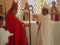 Bishop Mauricio Andrade, primate of the Anglican Episcopal Church of Brazil, gives a crosier to Bishop Saulo Barros IEAB 2006 mauricio saulo crosier.jpg