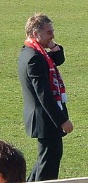 Jason McGill standing on a grass field