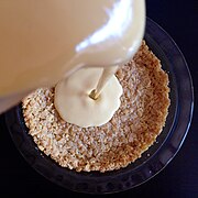 Custard is poured into crust and baked