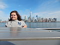 March 11, 2015 at Exchange Place station with Manhattan skyline (age 23)