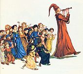 Un joueur de flûte à chapeau conique avance suivi d'une troupe d'enfants à l'air ébahi.