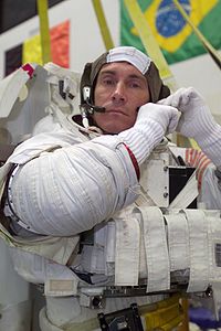 Expedition 11 Commander Sergei Krikalev dons a training space suit. Credit: NASA