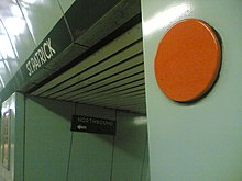An orange circle platform marker was used to assist the train guard as the train departed the station on Line 2 prior to 2017. An example from Line 1's St. Patrick station is pictured. St Patrick TTC orange dot.jpg