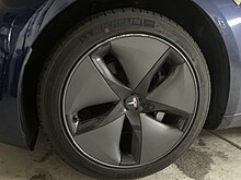 Alloy wheels with covers on a Tesla Model 3 Tesla Model 3 aero wheels.jpg