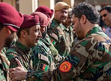Yasin Zia greeting troops