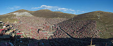 Larung Gar Buddhist Academy in Sertar, Garze, Sichuan. Founded in the 1980s, it is now the largest monastic institution in the world, with about 40,000 members of whom
.mw-parser-output .frac{white-space:nowrap}.mw-parser-output .frac .num,.mw-parser-output .frac .den{font-size:80%;line-height:0;vertical-align:super}.mw-parser-output .frac .den{vertical-align:sub}.mw-parser-output .sr-only{border:0;clip:rect(0,0,0,0);clip-path:polygon(0px 0px,0px 0px,0px 0px);height:1px;margin:-1px;overflow:hidden;padding:0;position:absolute;width:1px}
1/10 are Han. 1 Seda facing south.jpg