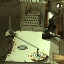 The monopole antenna of the base station is mounted on a bracket in the right rear part of the rover. Antenna for Ingenuity and Sky Camera on Perseverance.png