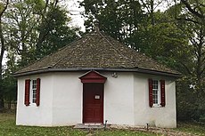 The octagonal school next to the meetinghouse.