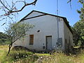 A large adobe building that was once part of the Bonanza Mine.