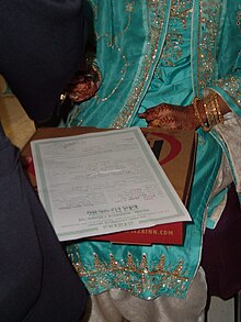 A Muslim bride of Pakistan origin signing the nikkah nama or marriage certificate Signing the Nikah.jpg