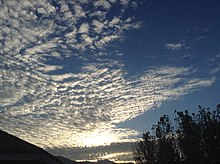 Sunrise scene giving a shine to an altocumulus stratiformis perlucidus cloud Sunrise (Abbottabad).jpg