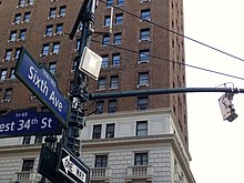 A Radio-frequency identification E-ZPass reader attached to the pole and its antenna (right) used in traffic monitoring in New York City TransCore RFID reader and antenna.jpg