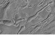 Banded or taffy-pull terrain in Hellas, as seen by Mars Global Surveyor. Origin is unknown at present.