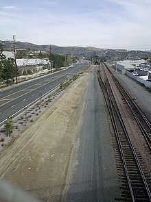 Rail tracks and roads often separate or bound cities. In this case, a BNSF right of way and Esperanza Road separate the strip mall on the left, which is in Yorba Linda, from the car dealership on the right, which is in Anaheim. Esperanza tracks.jpg