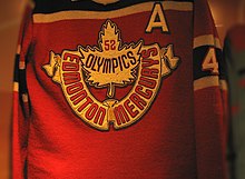 Red coloured jersey with a maple leaf crest