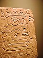 Chavín stela depicting a brindle face. National Museum Chavín de Huantar.