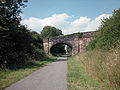 Looking eastbound towards the former station's site beyond the bridge.