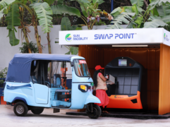 An electric rickshaw at a battery swapping point.