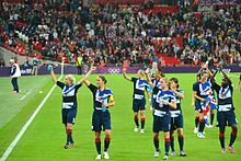 Team GB celebrating following victory against Brazil in their final group game Team GB celebrating, women's football.jpg