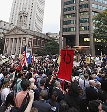 Protesters rallying near New York police headquarters, with St. Andrew's Church in the background Wallst14occupy.jpg