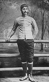 Walter Camp standing by the railing on a bridge