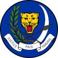 Variante del escudo de armas de la República del Zaire (1971 - 1997) en un disco azul.