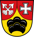 Gemeinde Stetten In Rot eine eingeschweifte goldene Spitze, darin ein schwebender schwarzer Sechsberg, vorne zwei schräg gekreuzte silberne Pfeile, hinten ein silbernes Ulrichskreuz.