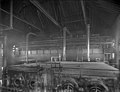 A black-and-white photo of the inside of the station, with pipes going into a machine.