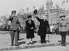 Princess Alice, Countess of Athlone, with the Earl of Athlone and William Lyon Mackenzie King, March 1946 KingCheersForAthlone.jpg