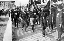 Benito Mussolini in the March on Rome that installed him as dictator in Italy Naples Fascist rally on 24 October 1922 (2).jpg