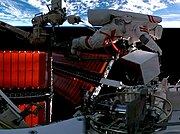 Taikonaut Fei Junlong performing a spacewalk on the Tiangong space station during Shenzhou 15