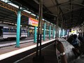 The platform and the building that separates the north and south side of the station with the Prambanan Express train on the left (2003)