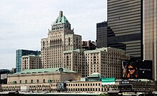 28-storey Châteauesque-styled building constructed in limestone bricks with copper roofing