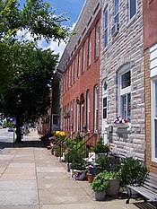 Simple row houses like these in Locust Point make up much of Baltimore's housing stock. Traditional rowhouses, Locust Point, Baltimore (100 0509).jpg