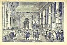 Dividend Day at the Bank, 1770. The Pay Hall of 1732 was one of the Bank's first buildings on Threadneedle Street. (At one time shareholders were required to attend in person for the payment of Government dividends; the practice was abolished in 1910). ONL (1887) 1.463 - Dividend Day at the Bank, 1770.jpg