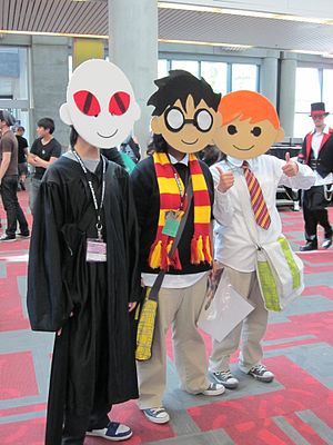 Cosplayers portraying Lord Voldemort, Harry Po...