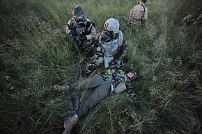 U.S. Airmen with the 633rd Air Base Wing participate in a mock base attack during exercise Eagle Flag at Joint Base McGuire-Dix-Lakehurst, N.J., Aug. 20, 2011 110820-F-NW323-1359.jpg