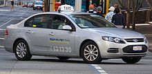 A dual fuel LPG-powered Ford Falcon taxicab in Perth, Australia 2011-2013 Ford Falcon (FG II) XT sedan, TriColor taxis (2017-04-22).jpg